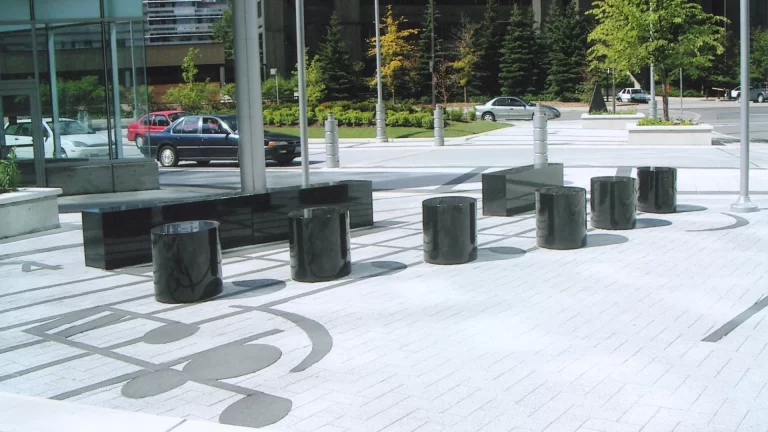 Black granite bollards shaped like musical notes